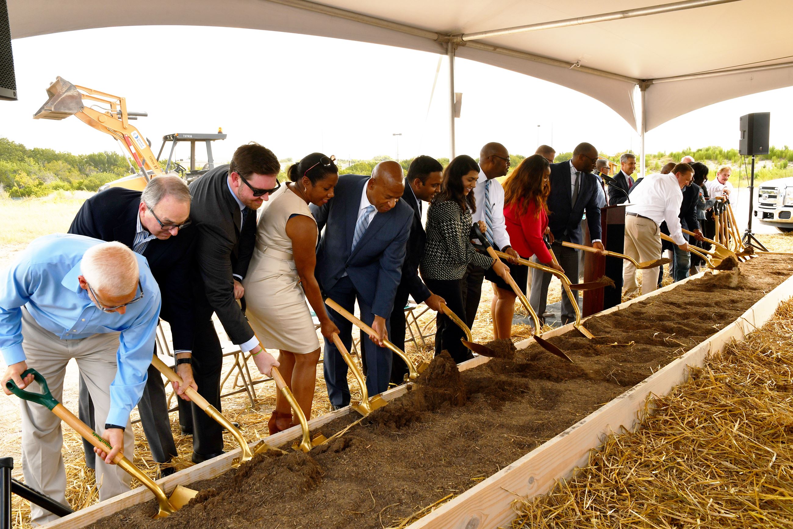 City Council Members and Guests shovel dirt at the Hotel & Convention Center groundbreaking